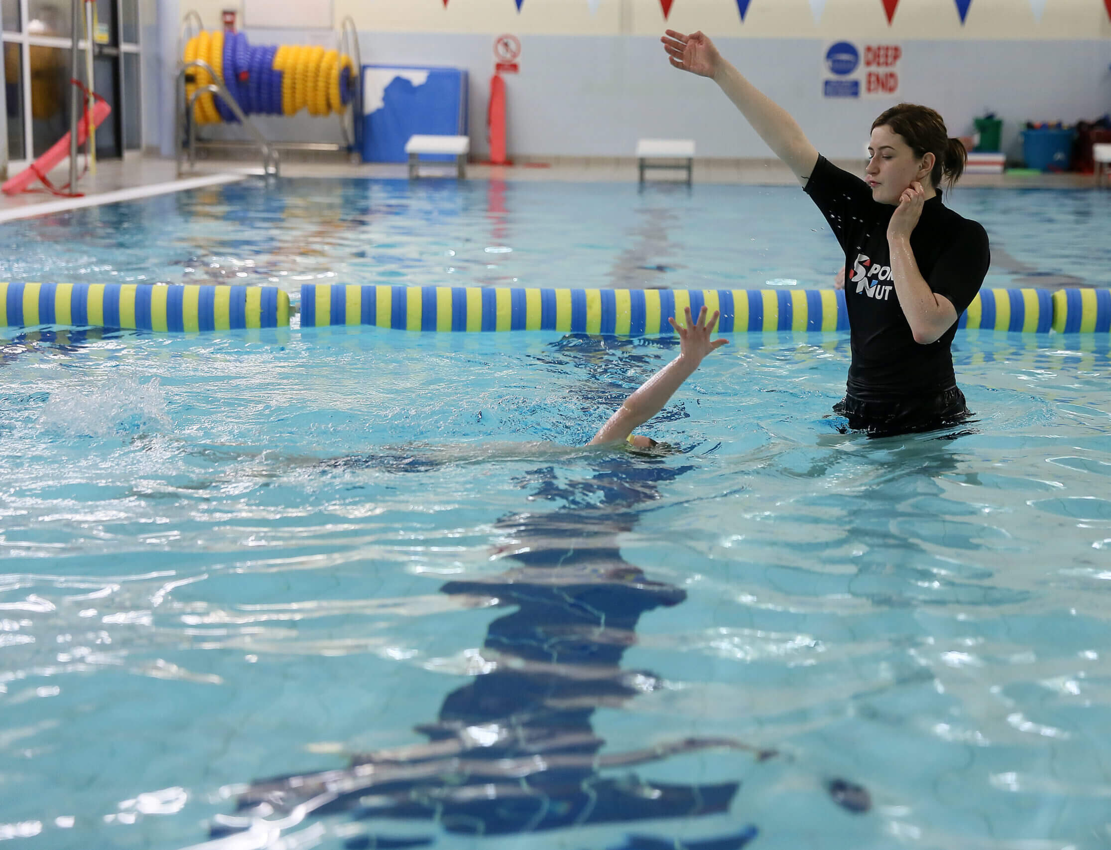 Instructor with raised hand