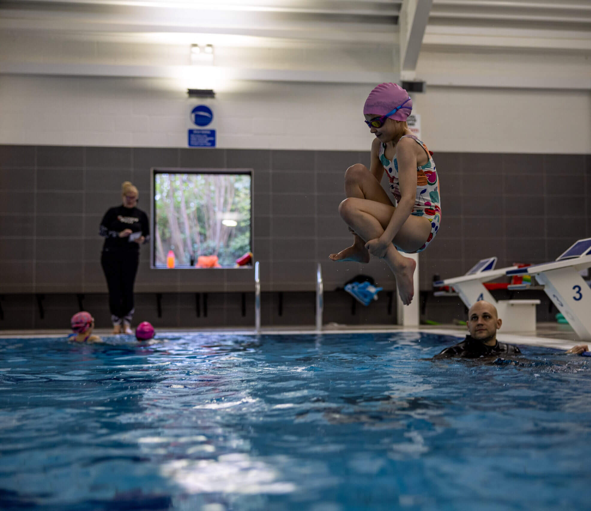 Jumping into the pool at Godstowe Swim School, High Wycombe