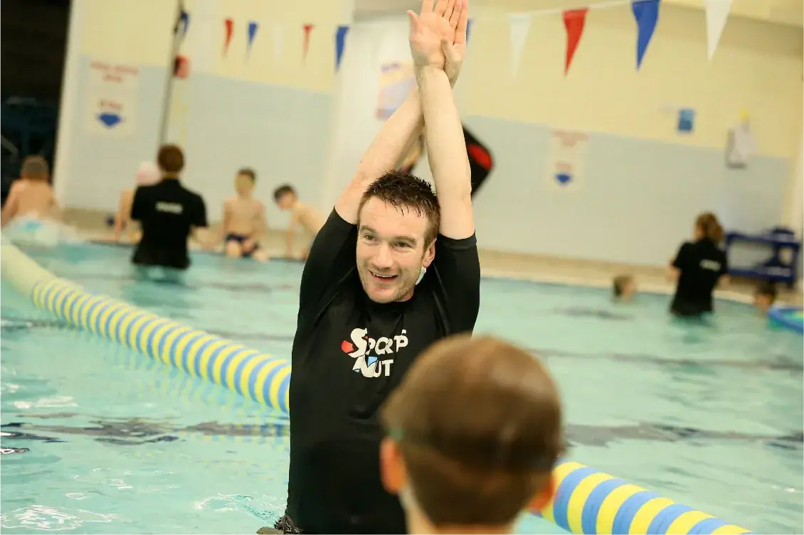 man stretching hands above head